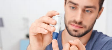 Man checking his blood sugar level